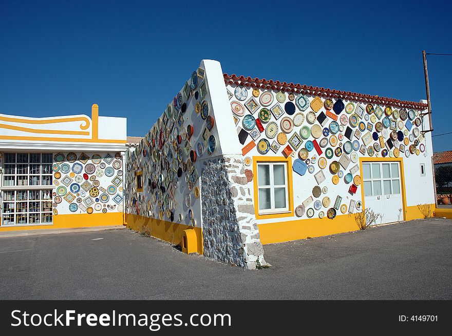 White and yellow house of Portugal, the wall decorate in ceramics, Algarve region