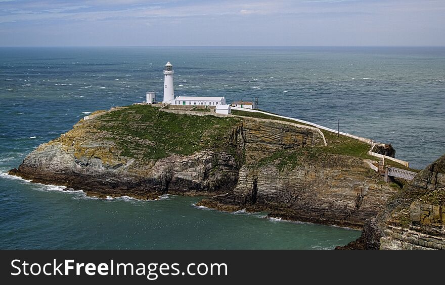 Situated near the north west tip of Wales, the tiny islet known as South Stack Rock lies separated from Holyhead Island by 30 metres of turbulent sea. Situated near the north west tip of Wales, the tiny islet known as South Stack Rock lies separated from Holyhead Island by 30 metres of turbulent sea.