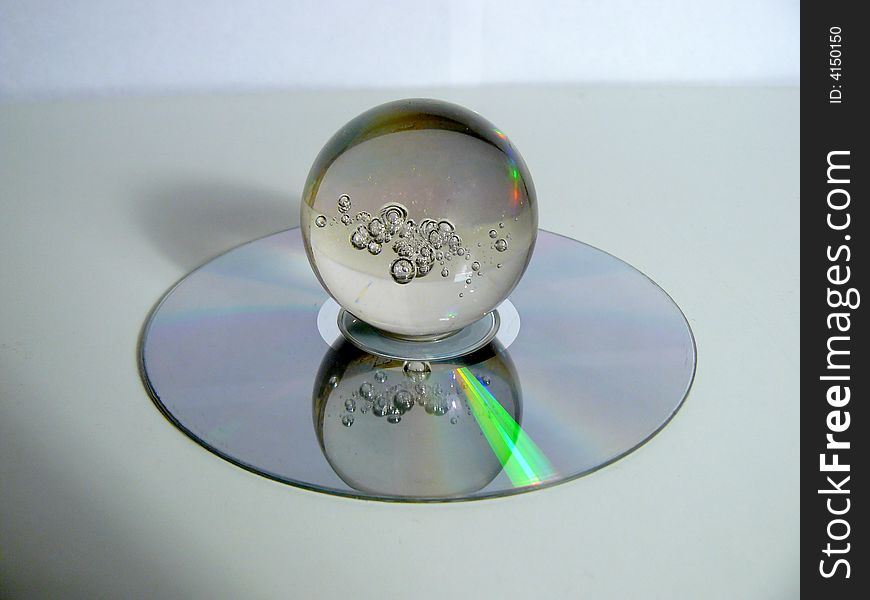 Glass sphere laying on a disk. Glass sphere laying on a disk