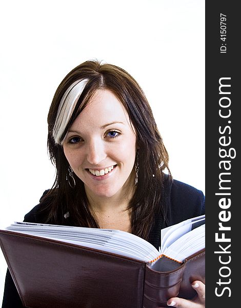 Photo of a young woman reading a book with a high key background