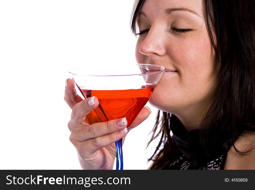 Young woman with blue eyes holding a red martini. Young woman with blue eyes holding a red martini