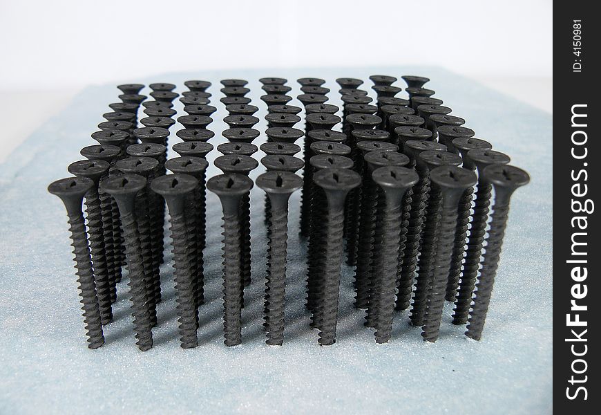 Numbers of vertically costing black screws. Numbers of vertically costing black screws