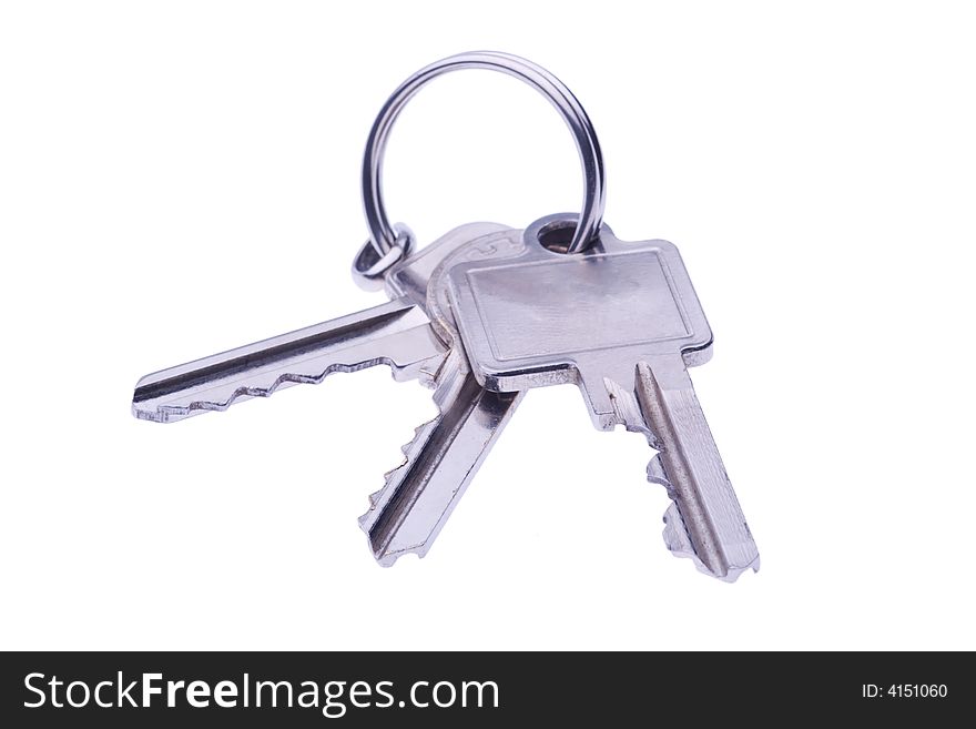 Set of keys on key-ring isolated on white. Set of keys on key-ring isolated on white