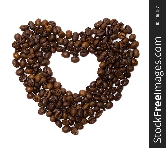 Heart made of coffee beans isolated at the white background. Heart made of coffee beans isolated at the white background