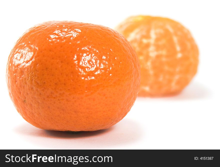 Two tangerines over white background