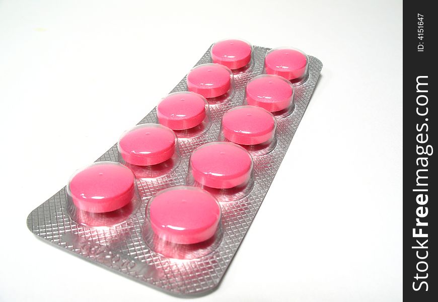 Detail of pink medical tablets. Detail of pink medical tablets