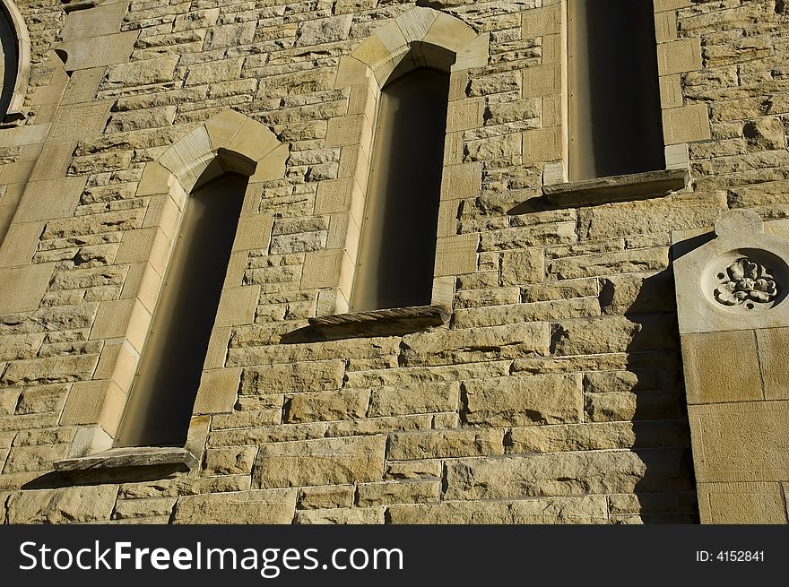 Closeup of Church with windows and sandstone texture