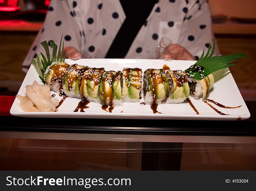 This is raw fish in the case of a sushi counter.