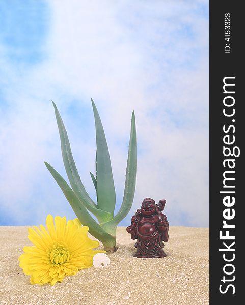 Aloe Plant on Sand With Buddha and Yellow Flower. Aloe Plant on Sand With Buddha and Yellow Flower