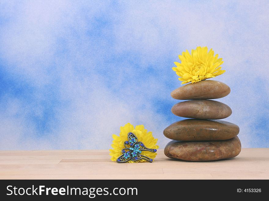 Balanced Massage Stones on Blue Textured Background