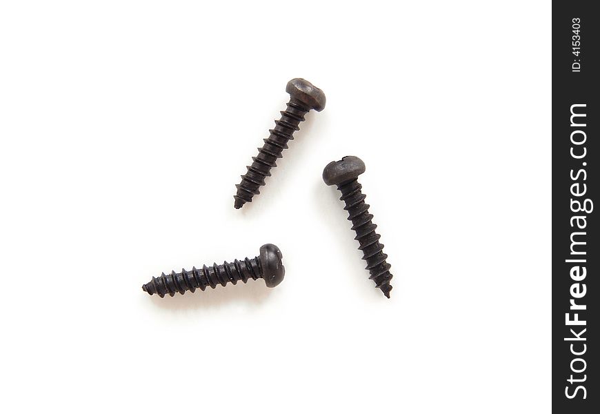 Three black screws isolated on white background