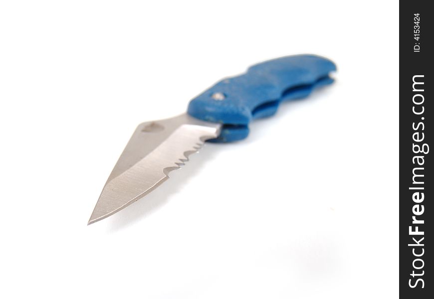 Small silver metal pocket knife with blue handle over white