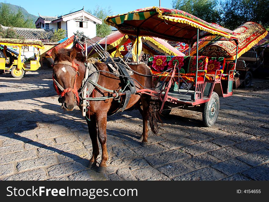 Horse-drawn cart on the flagging of Shuhe,Lijiang,Yunnan, a world Culture Heritage. Horse-drawn cart on the flagging of Shuhe,Lijiang,Yunnan, a world Culture Heritage.