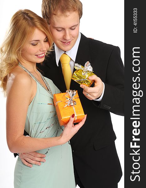 Young happy attractive couple with gifts