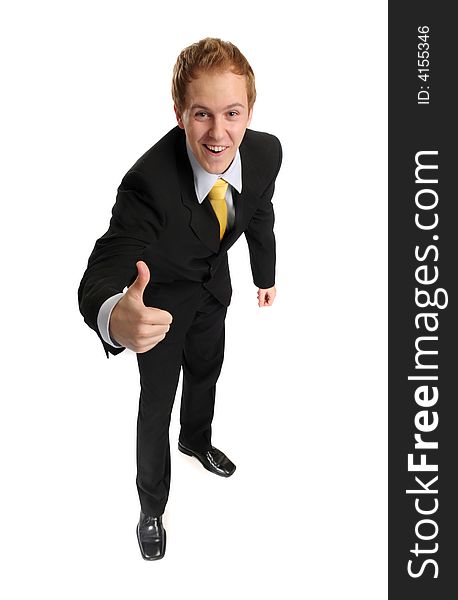 Young smart smiling businessman doing success gesture