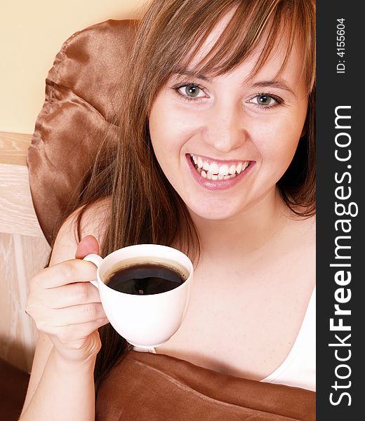 Morning in the bed/ smiling woman with coffee. Morning in the bed/ smiling woman with coffee