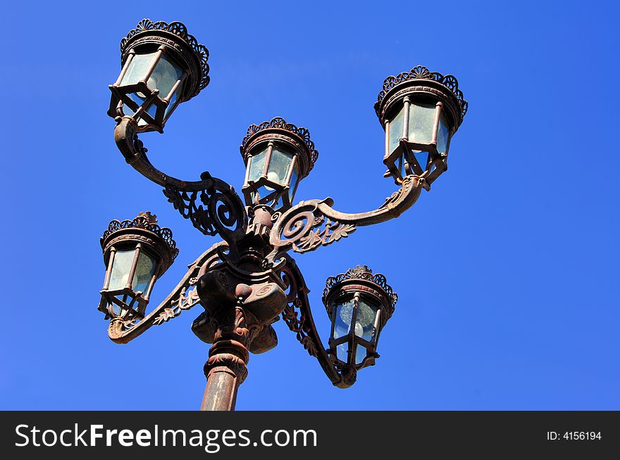 Portugal, Ponte de Lima: blue sky and a wonderful antic lamppost or street light. Portugal, Ponte de Lima: blue sky and a wonderful antic lamppost or street light