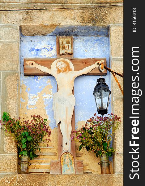 Portugal, Ponte de Lima: ancient statue of Christ on a cross