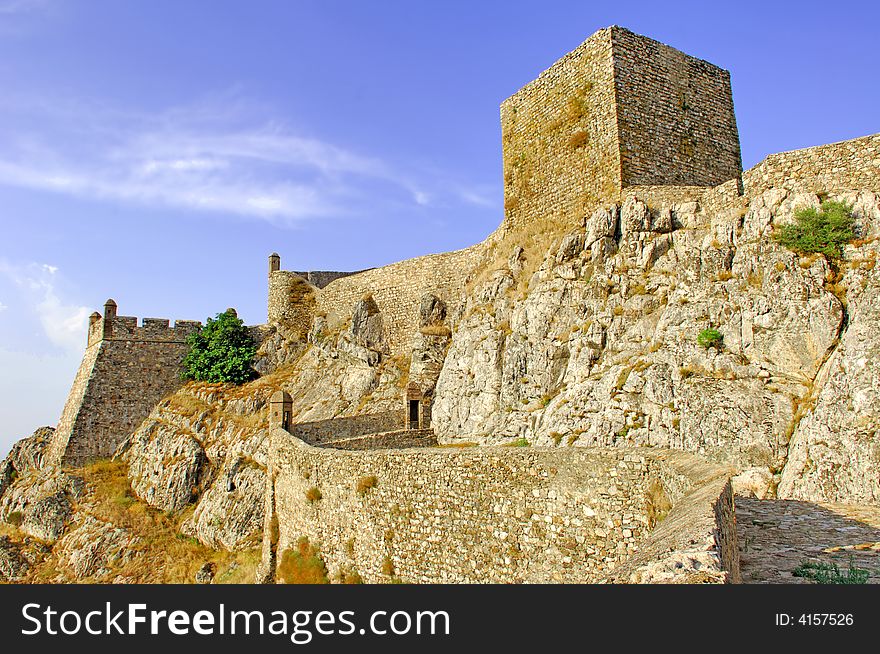 Portugal, area of Alentejo, Marvao: view of the castle; blue sky and a nice stone defensive wall. Portugal, area of Alentejo, Marvao: view of the castle; blue sky and a nice stone defensive wall