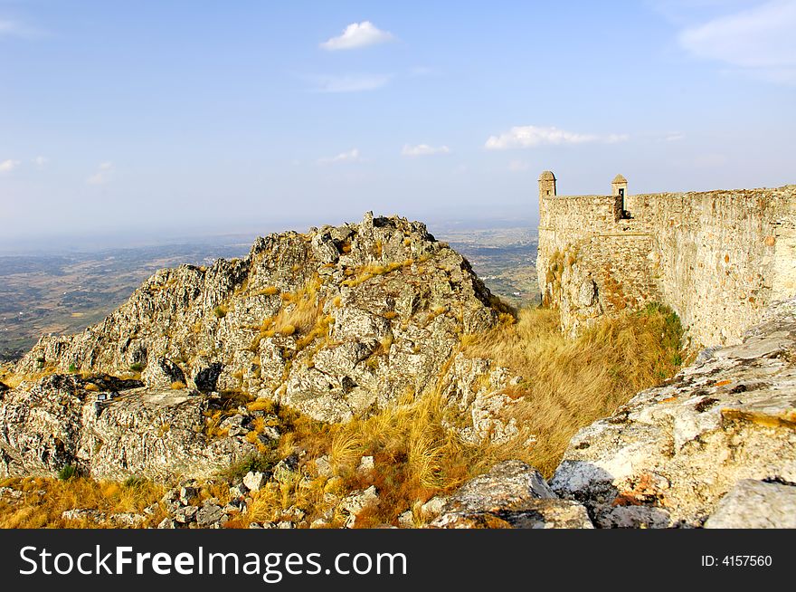 Portugal, area of Alentejo, Marvao: view of the castle; nice landscape with blue sky and yellow stones. Portugal, area of Alentejo, Marvao: view of the castle; nice landscape with blue sky and yellow stones