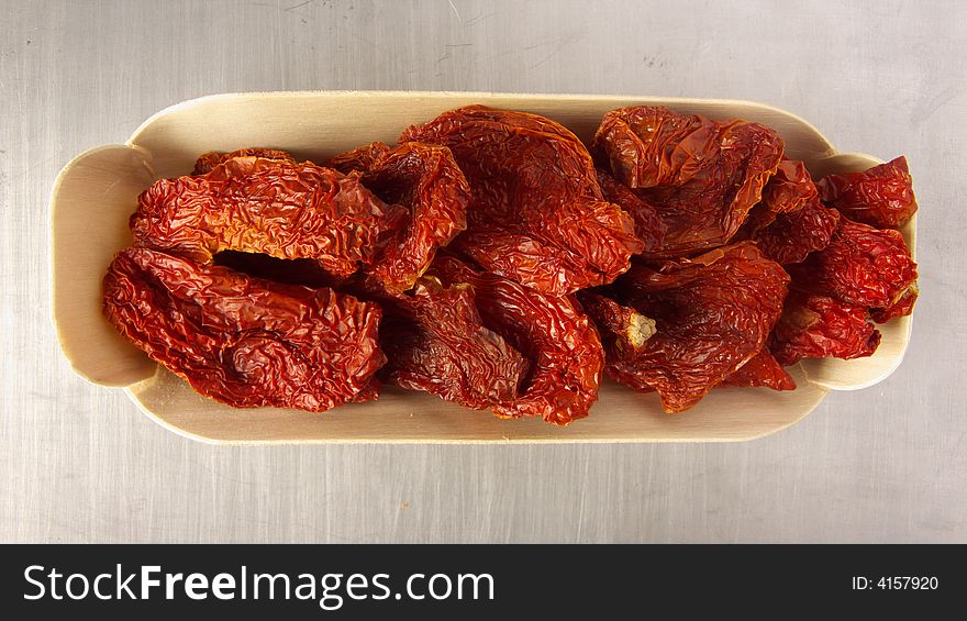 Dried red tomatoes arranged in a bowl. Dried red tomatoes arranged in a bowl