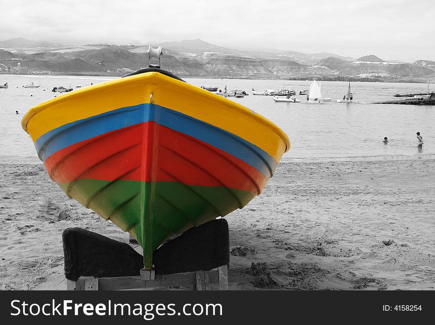 Colorful boat on the sand in a faded day. Colorful boat on the sand in a faded day