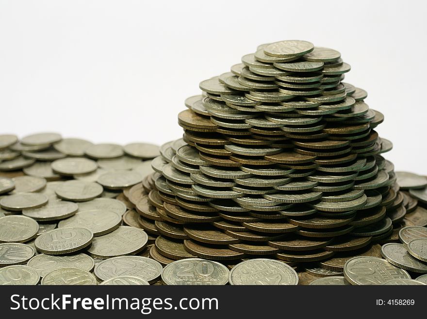 Close-up of pile of coins on the white background (isolated on white)