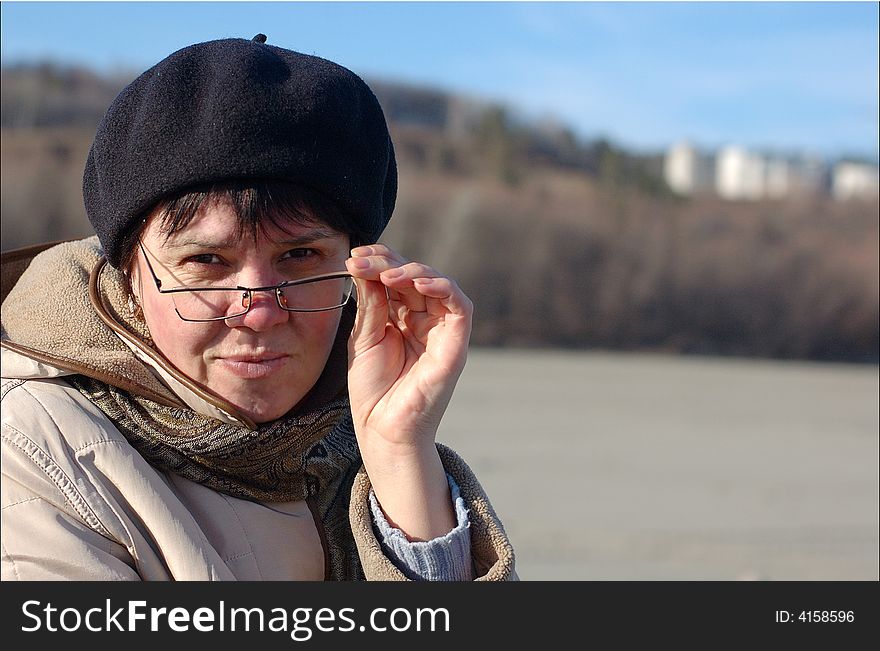 Portrait of woman in glasses looking back at the camera. Portrait of woman in glasses looking back at the camera