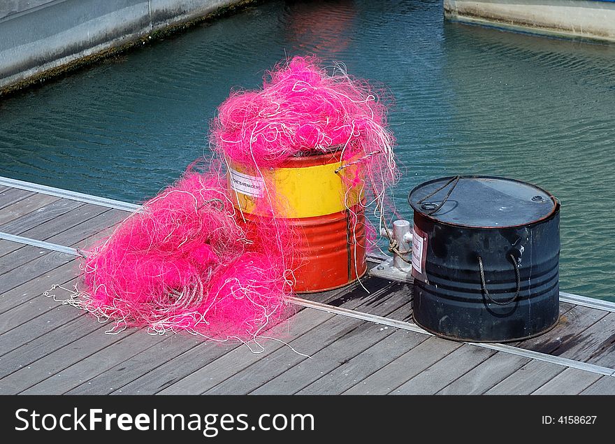 Fishing net in a can left on a wharf