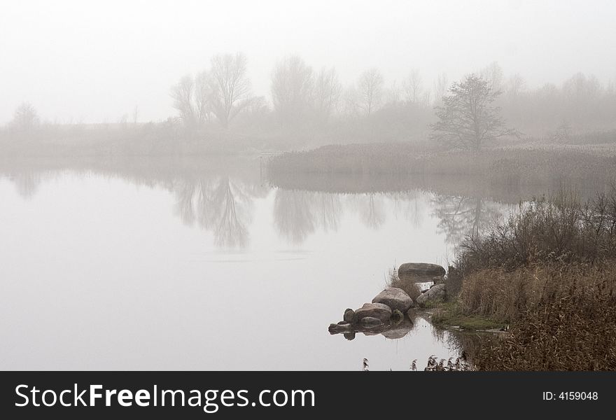 Quiet smooth surface of the river in a fog. Quiet smooth surface of the river in a fog