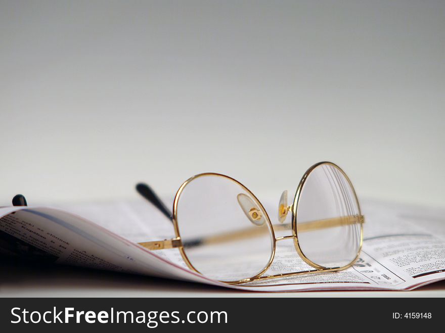 Newspaper And Glasses