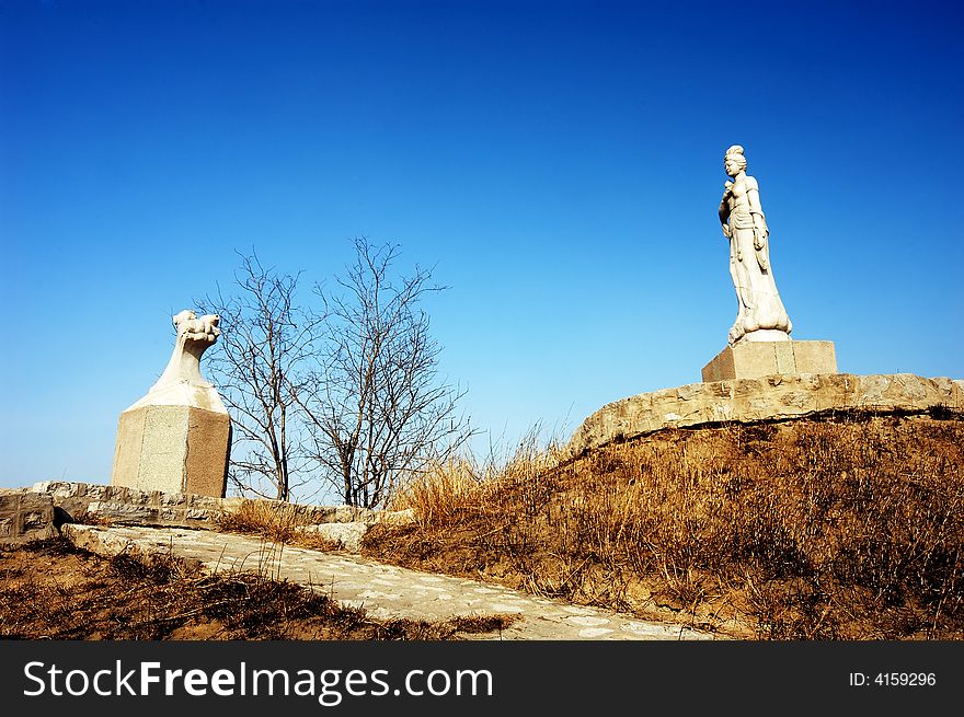 Bodhisattva statue against the blue sky