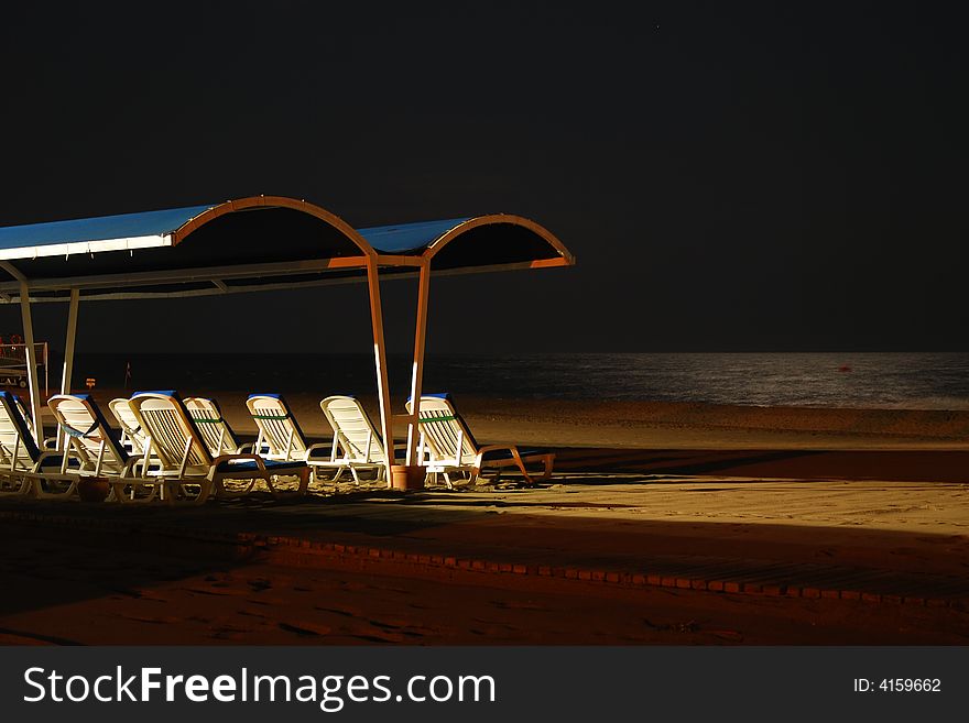 Hight beach and  white lounges