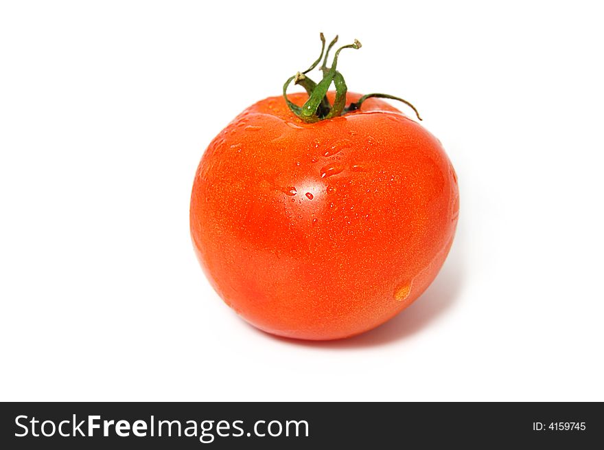 One red tomato with green ends isolated on white