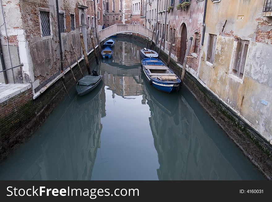 Venetian canal with boats, Veince, Italy. Venetian canal with boats, Veince, Italy