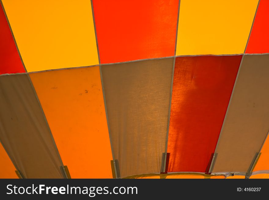 Close up shot of the canvas of a red and yellow hot air balloon. Close up shot of the canvas of a red and yellow hot air balloon