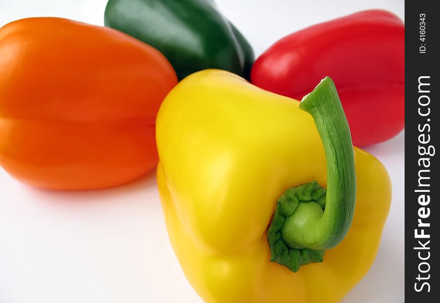 Four multiple colored peppers