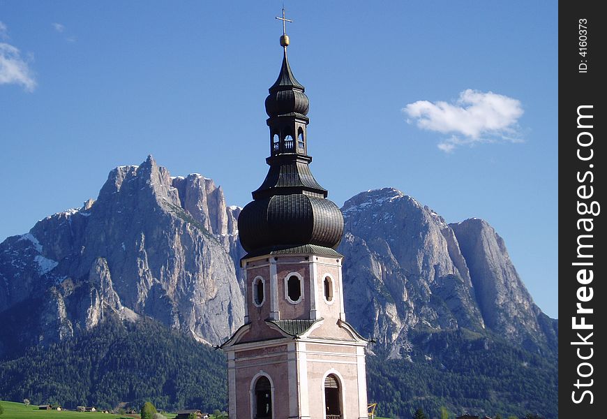 Beautiful bell tower with the background of mountains. Beautiful bell tower with the background of mountains