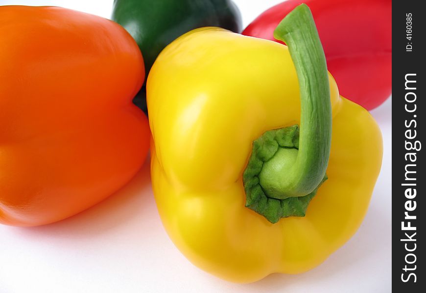 Four multiple colored peppers