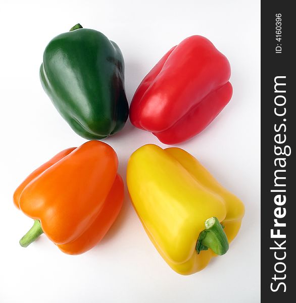 Four multiple colored peppers