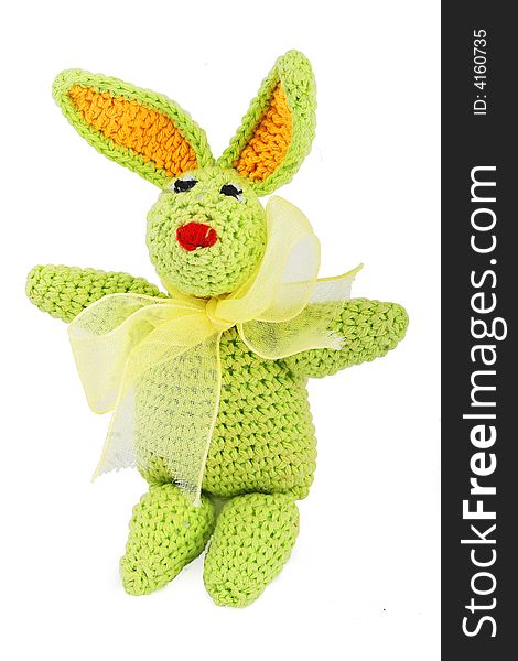 Hand made tiny green knitted easter bunny with gold bow. Hand made tiny green knitted easter bunny with gold bow