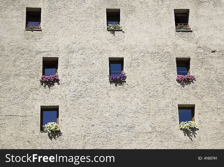 Little windows in a building of the Cogne village, Aosta Valley (Italy)