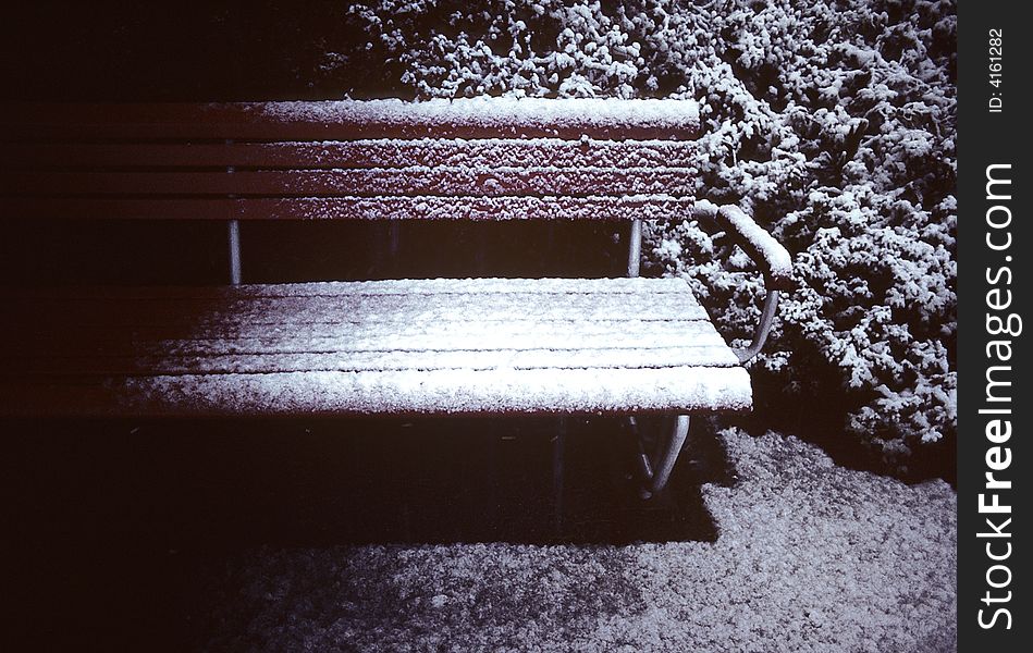 Lonely bench on the snowy ground, early morning. Source: scan film. Lonely bench on the snowy ground, early morning. Source: scan film