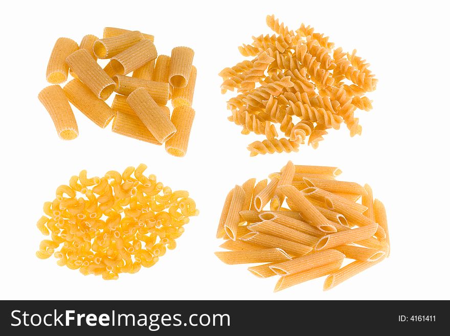 Healthy ziti,rigatoni, fusilli, and ebows pasta on a white background. Healthy ziti,rigatoni, fusilli, and ebows pasta on a white background