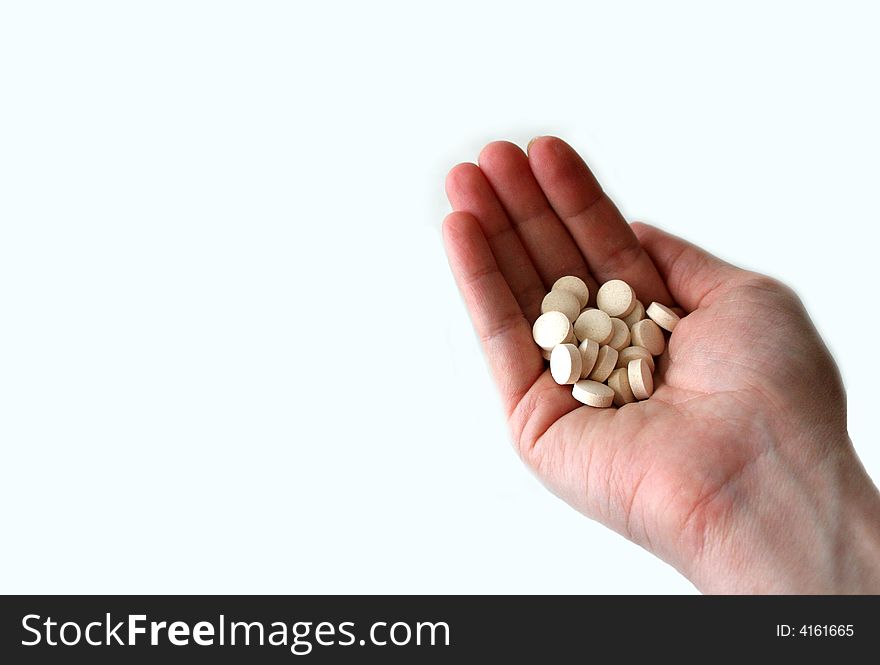 This is a handful of pills that could signify prescribing, dosing, compliance, etc. There is room to the left of the hand for text. This is a handful of pills that could signify prescribing, dosing, compliance, etc. There is room to the left of the hand for text.