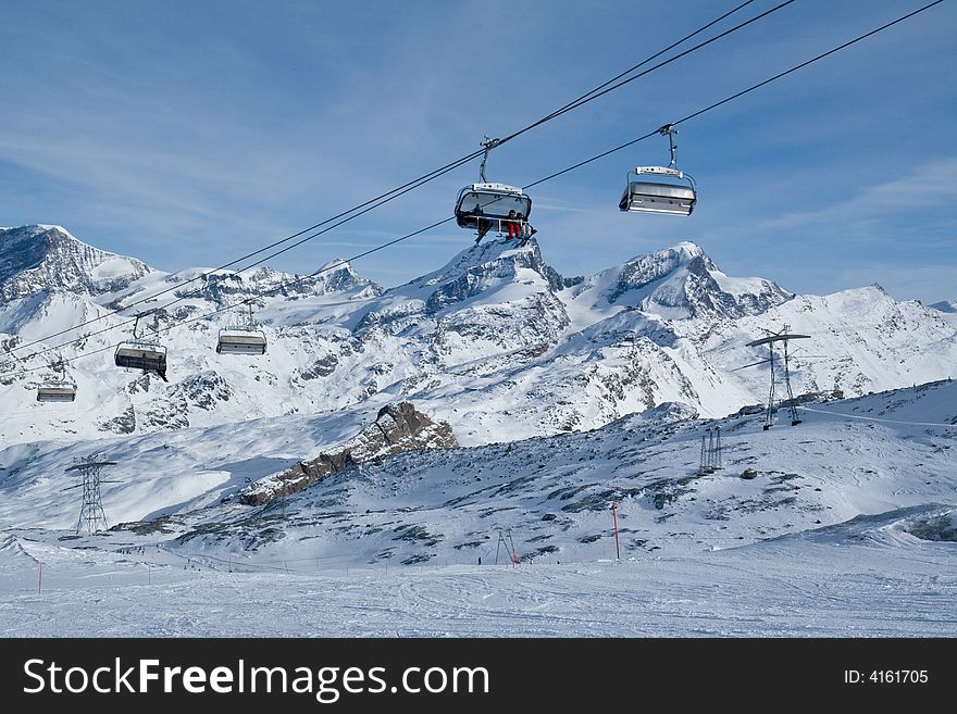 Chair lift in Swiss Alps. Skiing. Winter. Chair lift in Swiss Alps. Skiing. Winter.