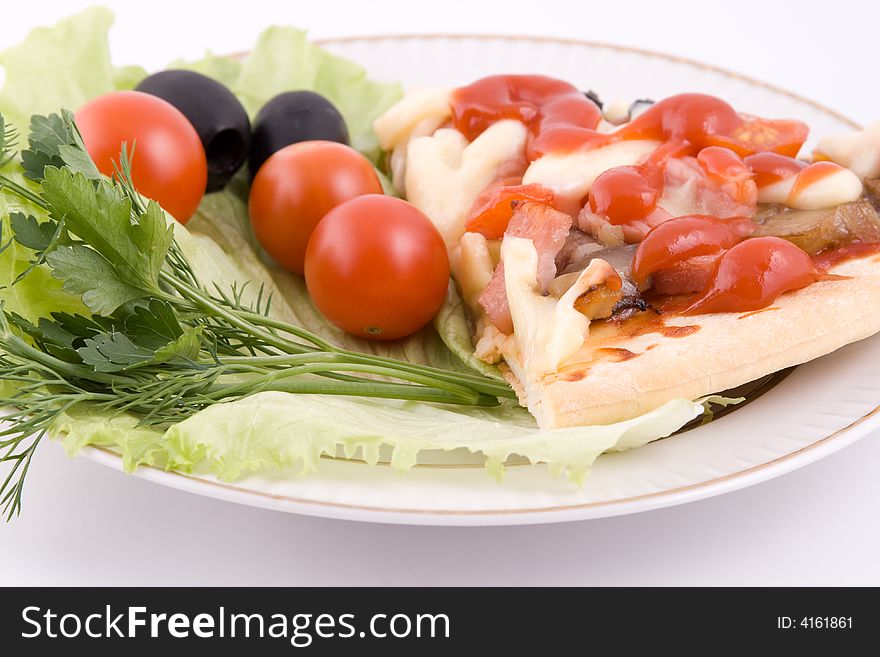 Piece of a pizza with vegetables on a plate on a white background (close up)