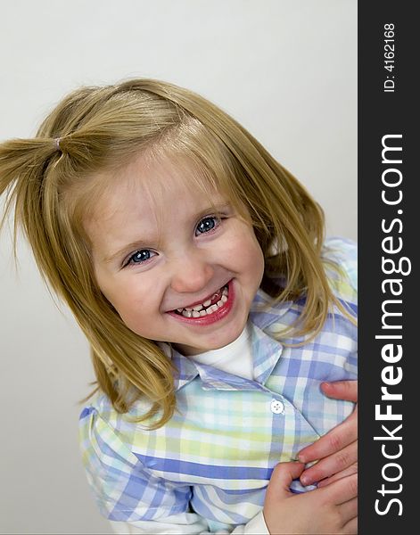 Happy, smiling two year old girl with big blue eyes and blond straight hair. Happy, smiling two year old girl with big blue eyes and blond straight hair