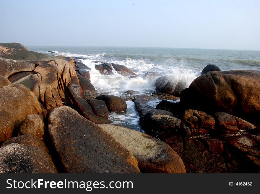 Round Boulders By The Sea