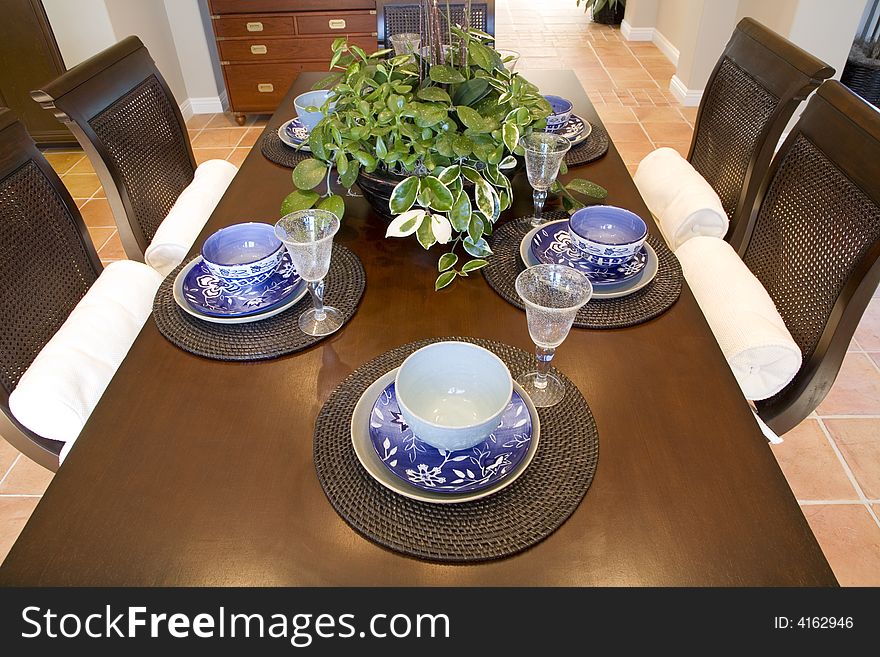 Festive dining table with luxurious dinnerware and decor. Festive dining table with luxurious dinnerware and decor.